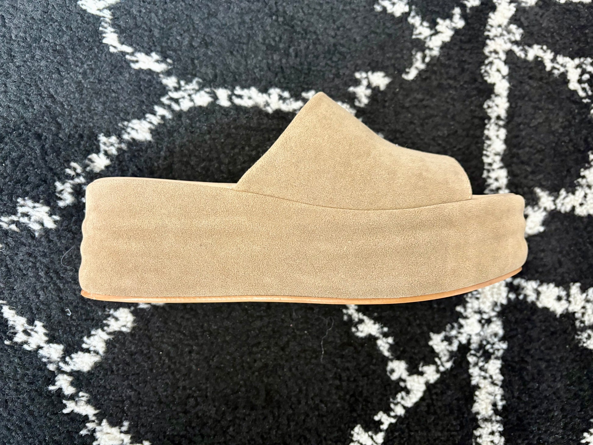Side view of the Hazel Platform Slide sandal in tan faux suede with a thick, solid platform sole