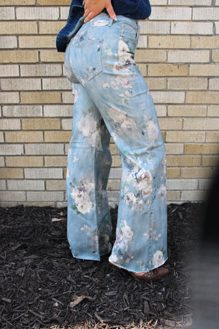 Side view of Women's high rise floral wide leg jeans with soft vintage-inspired flower print