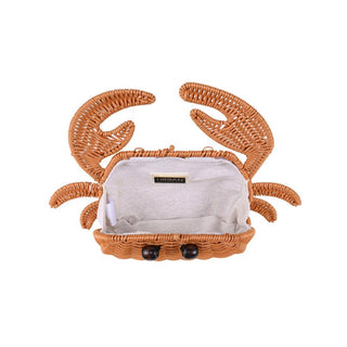 Interior of crab-shaped handbag with a white interior.