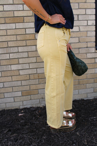 Side view of JBD butter yellow straight leg jeans with 27 inch inseam and side seam detail