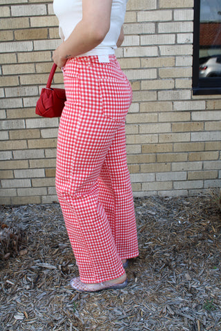 Side view of red and white gingham high rise straight jeans with relaxed summer styling available at Erin Rose Boutique