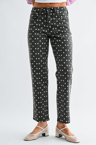 Woman wearing JBD Vintage Polka Dot Straight Jeans in a black vintage wash with cream polka dots.