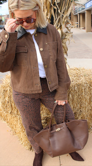 Woman wearing the Joann Vintage Brown Barn Jacket with brown leopard bottoms