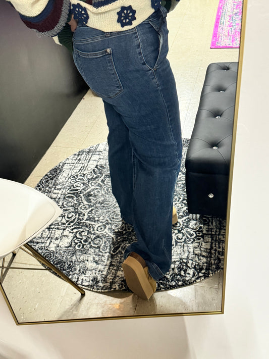 Back view of Judy Blue dark wash wide leg jeans for women featuring a high-rise fit and flattering pocket placement

