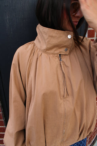 Women wearing the Ken camel jacket with funnel neck and zip front.  Available at Erin Rose Boutique