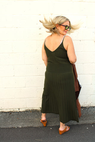 Full length view of olive green knit maxi dress