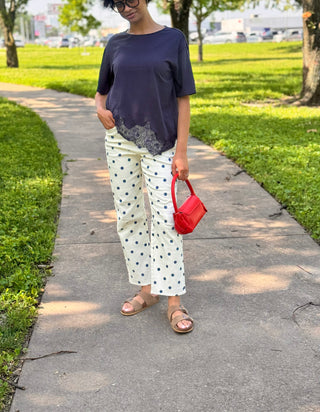 Polka dot barrel-leg denim styled with a navy top