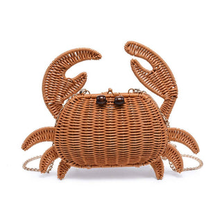 Woven rattan-inspired crab crossbody bag with a whimsical design and gold chain strap.