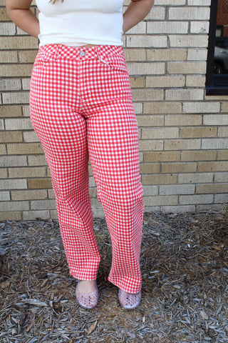 Front view of red and white gingham high rise straight jeans with relaxed summer styling.