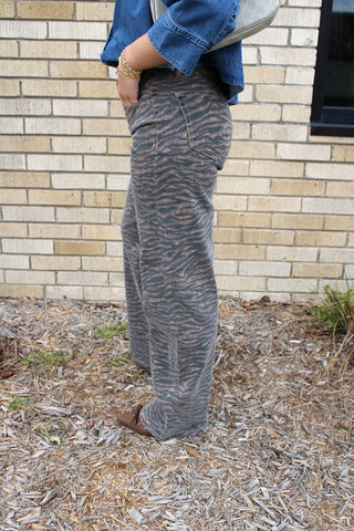 Side view Logan Hidden Tiger Print High Rise Dad Jean in brown and black animal print denim.