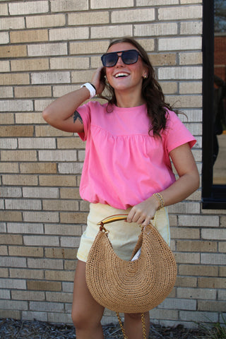 Tilly Bubble Hem Top in bright pink featuring a relaxed fit, gathered yoke detail, and flattering bubble hem silhouette.