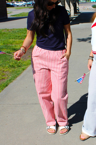 Women's statement gingham pants paired with a casual graphic tee.