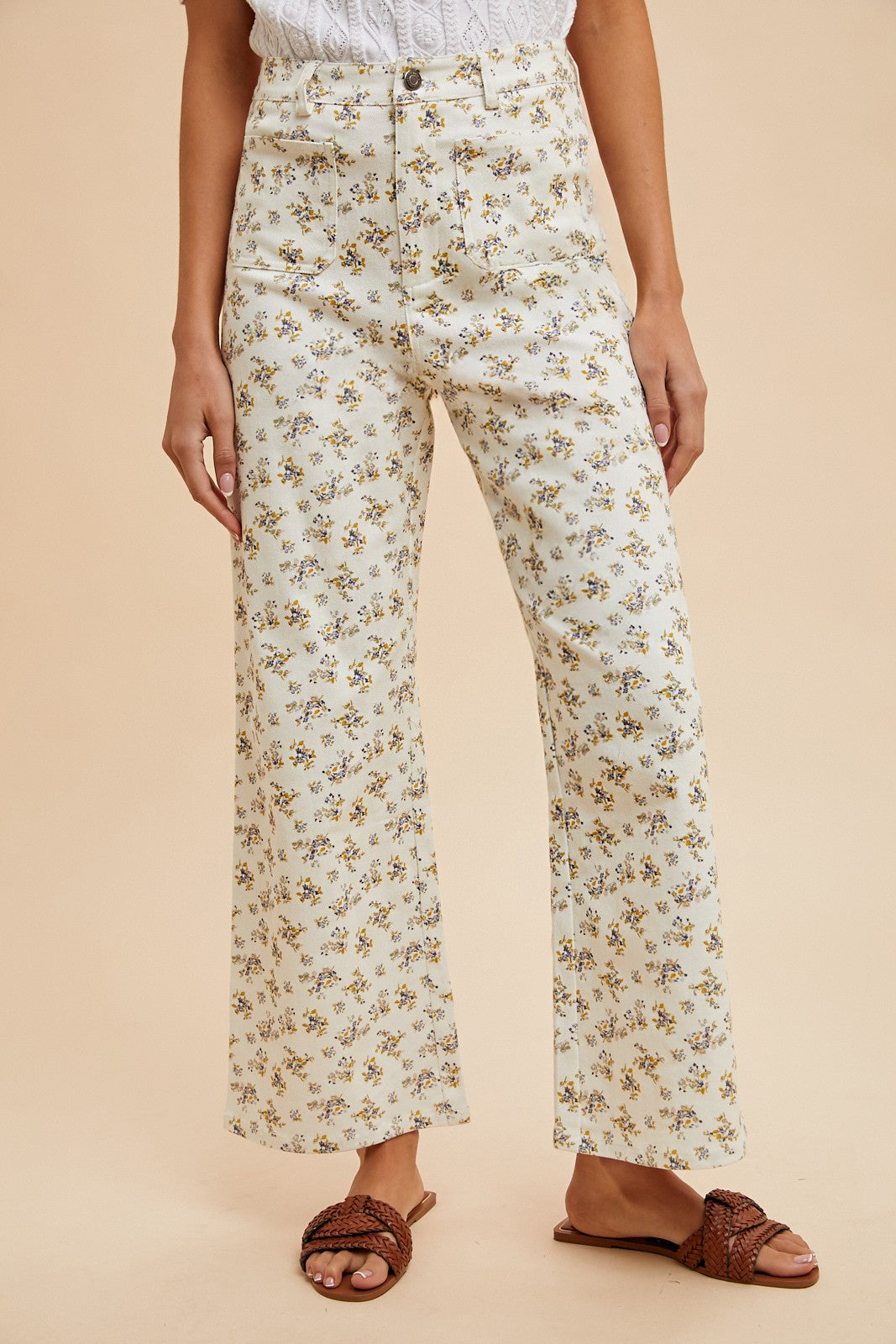 "Front view of white high-waisted wide leg pants with yellow and blue floral print – Erin Rose Boutique