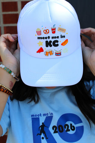 White Meet Me In KC graphic trucker cap with popcorn, pretzel, and fireworks icons