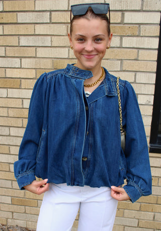 Women's lightweight denim jacket with high collar and modern elevated fit.