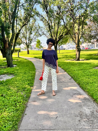 Women’s ivory and navy polka dot barrel pants