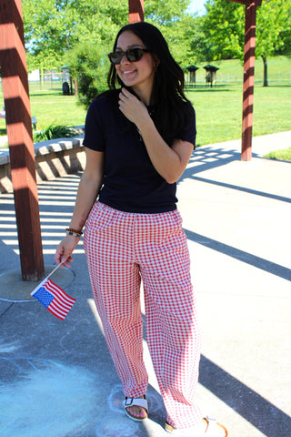 Red and white gingham barrel pants styled with a navy graphic tee.